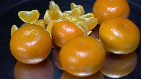 Tangerines close-up on a rotating surface Stock Footage 165076964