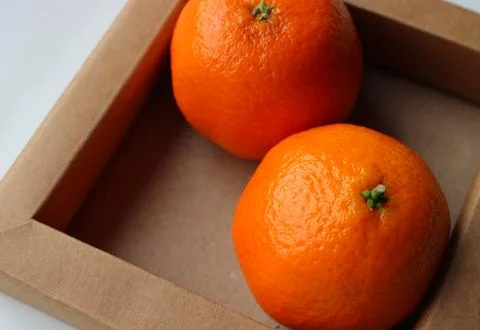 Tangerines in a Craft Tray Angle View Closeup Image Stock Photos