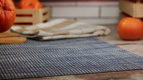 Tangerines fall on the table in slow motion Stock Footage 156859098