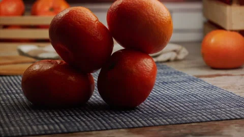 Tangerines fall on the table in slow motion Stock Footage 156872458