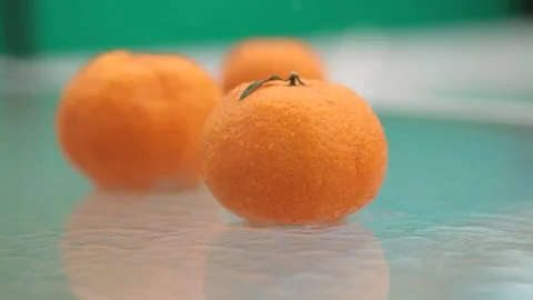 Tangerines lie on the table in the rain Stock Footage 170431354