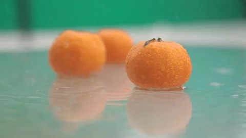 Tangerines lie on the table in the rain Stock Footage 170431390