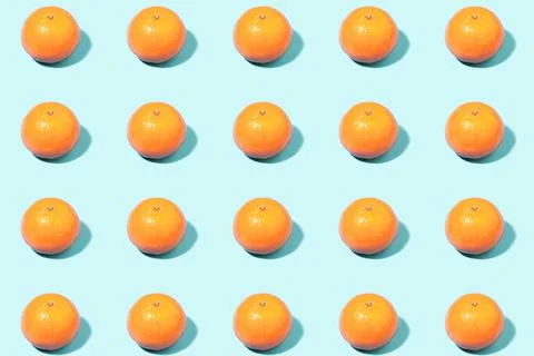 Tangerines on a light-mint background Stock Photos