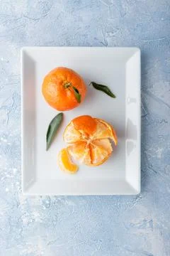 Tangerines on plate Stock Photos