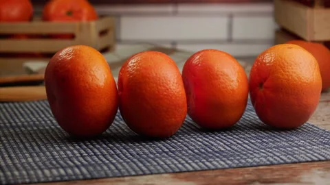 Tangerines rolling in the kitchen in slow motion Stock Footage 156872359