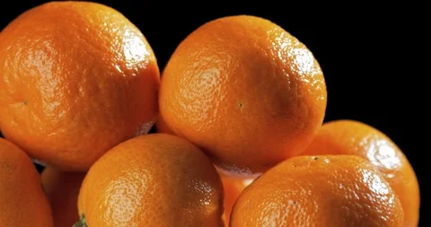 Tangerines rotating on black background Stockbeeldmateriaal 122051451