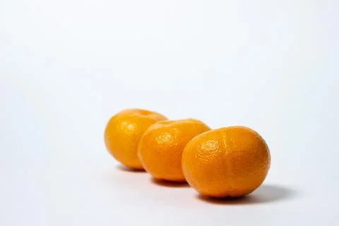 Tangerines on a white background. Citrus fruit.  Stock Photos