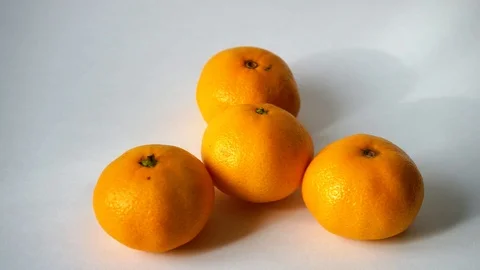 Tangerines on white background. I put tangerine. 3 Video stock 97707508