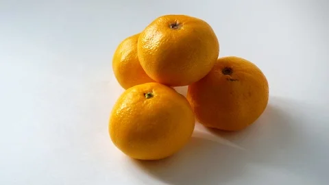Tangerines on white background. I put tangerine. 4 Stock Footage 97707510