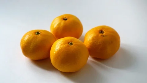 Tangerines on white background. I put tangerine. 5 Stock Footage 97707521