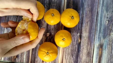 Tangerines on the wooden table Stock Footage 227721921