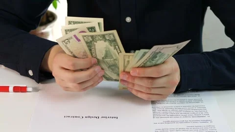 The tangible result of a closed agreement is shown in this close-up, where cash Stock Footage 318212964