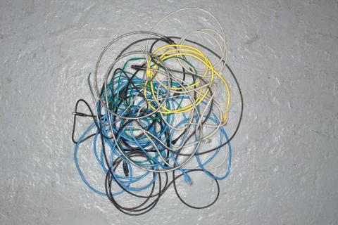 A tangle of colored wires on the ground Stock Photos