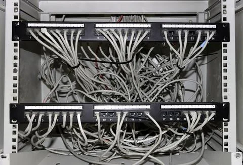 Tangle of data cables in an ethernet station Stock Photos
