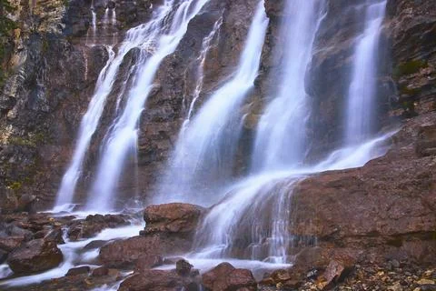 Tangle Falls Waterfall Cascading Over Rocky Cliffs in Jasper National Park Stock Photos