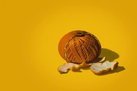 A tangle of orange threads in a peeled orange. Stock Photos