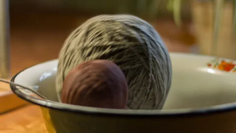 Tangle of wool yarn lays in a big bowl Stock Footage 142412220