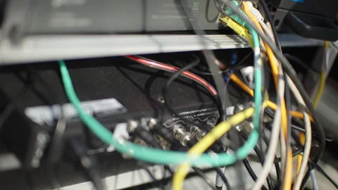 Tangled AV Cables and Connectors in Broadcast Equipment Rack Stock Footage 339382659