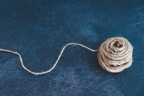 Tangled ball of thread with string popping out of it Stock Photos