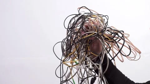 A tangled ball of wires on a white background Stock Footage 313343287