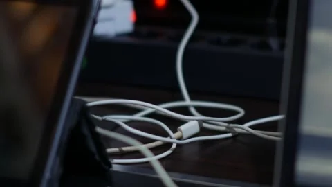 Tangled Charging Cables on Cluttered Home Office Desk Stock-Footage 340344410