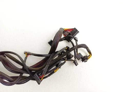 Tangled Computer Power Supply Cables and Connectors on White Background Stockfoto's