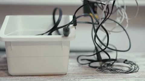 Tangled cords and cables on a table. Video stock 319295078
