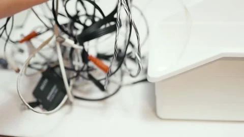 Tangled cords and cables on a table. Stock Footage 319295086