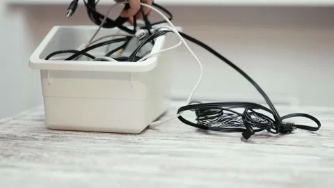 Tangled cords and cables on a table. Video stock 319295093