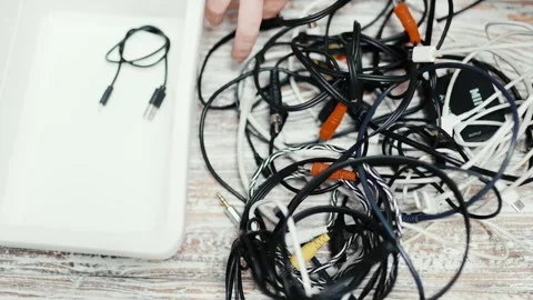Tangled cords and cables on a table. Stock Footage 319295100