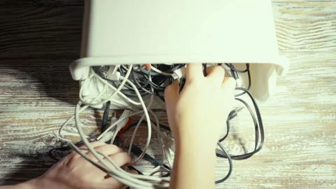 Tangled cords and cables on a table. Stock Footage 319295101