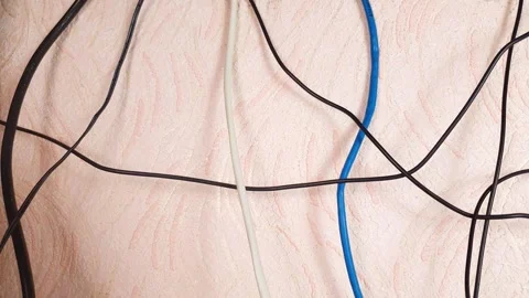 Tangled electrical wires. Internet cables, electrical cables, and wiring home. Vídeos de archivo 347090327