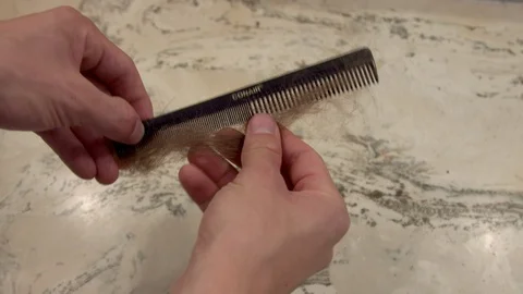 Tangled hair removal Stock Footage 128993579
