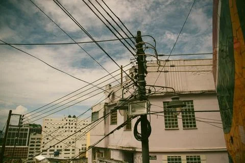 Tangled high-voltage power lines on a utility pole in Rio de Janeiro Stock Photos