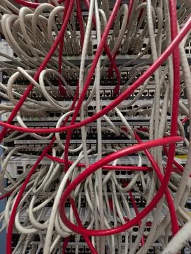 Tangled Network Cables: Digital Data Infrastructure Chaos Stock Photos