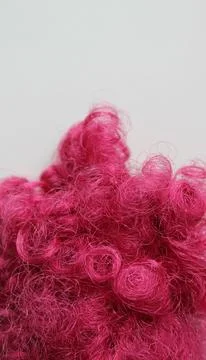 Tangled pink synthetic threads of thin diameter closeup view Stock Photos