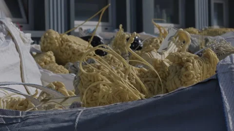 Tangled Recycled Plastic Filament Balls in Bulk Bags at Recycling Factory Stock Footage 336424119