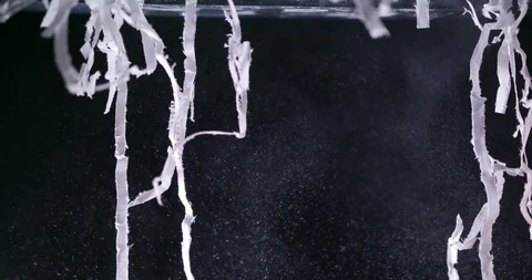 Tangled shredded paper being torn up and falling creating dusty mess Video stock 123736157