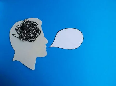 Tangled Thoughts and Blank Speech Bubble on Blue Background Stock Photos