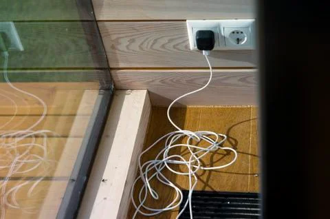 Tangled USB cable on the floor 写真素材