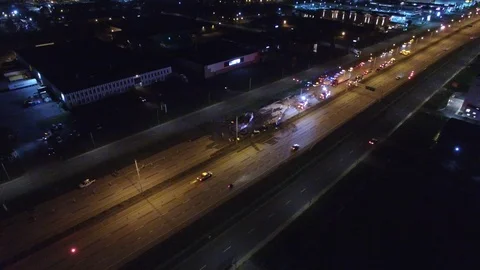 Tangled wreck viewed from drone after dramatic fiery crash on freeway - 24fps Stock Footage 104043723