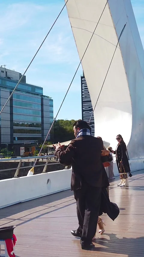 Tango Couple Dancing on Puente de la Mujer With Spectators and Puerto Madero Video stock 336782911