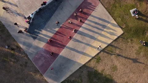 Tango couples dancing outdoors in a class at Park of Buenos Aires at sunset Stock Footage 210456827