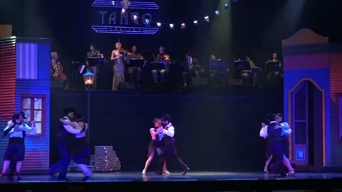 Tango dancers perform on stage Stock Footage 143374596