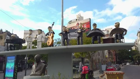 Tango Orchestra Monument with Delivery Boy and Street Traffic on Avenida Video stock 337526774