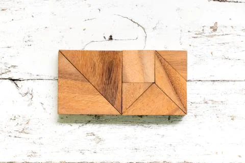 Tangram puzzle in rectangle or square shape on old white wood background Stock Photos