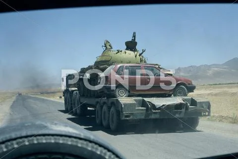 Tank And Small Car On Transporter Near Kabul, Afghanistan.