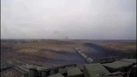 The tank drives forward and fires shots from time to time. Stock Footage 325566641