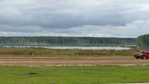 The tank drives through the range at high speed Stock Footage 138315037