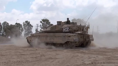 Tank driving through sand, coming to a halt. Military equipment. 動画素材 233698528